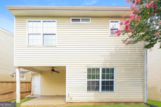 a view of a house with a window and sitting area