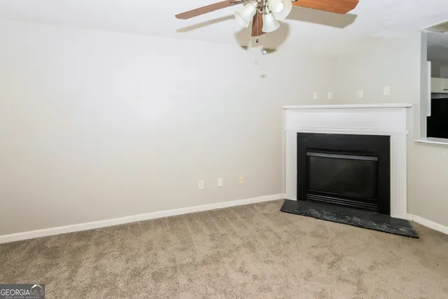 an empty room with a fireplace