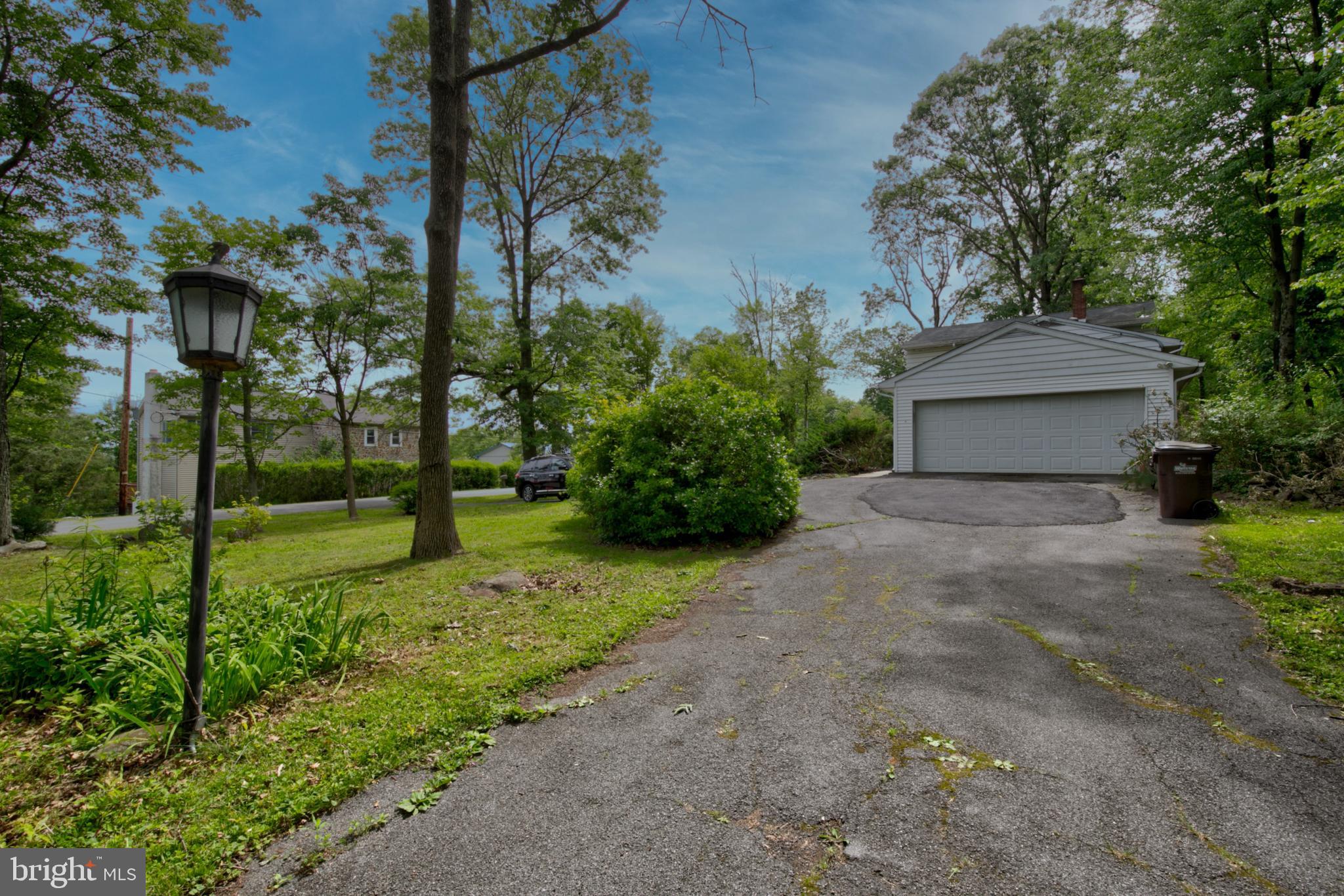 614 Mock Road Pottstown, PA 19464 - Photo 3 of 31 Side driveway and garage