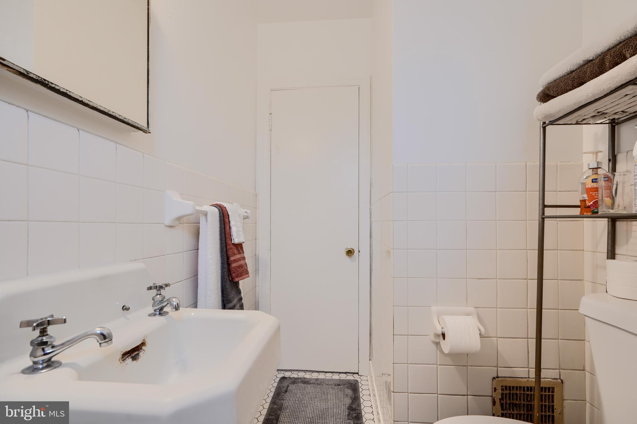 3119 White Way Road Baltimore, MD 21219 - Photo 23 of 41 a bathroom with a sink and a tub