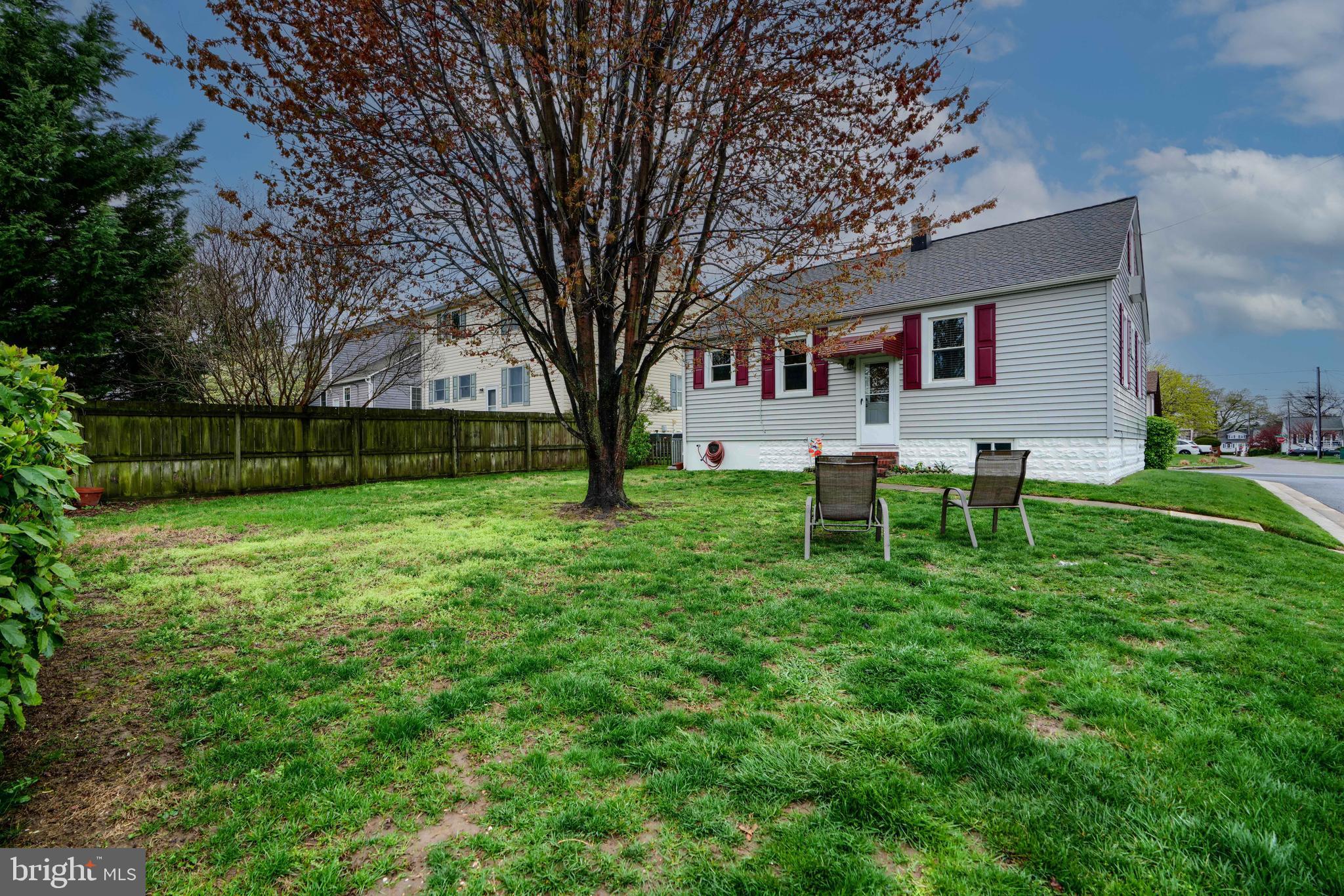 3119 White Way Road Baltimore, MD 21219 - Photo 33 of 41 a white house with a big yard and large trees