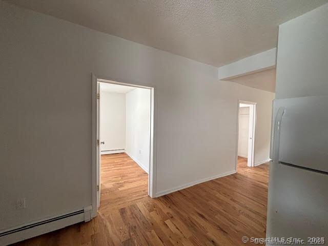 243 North Elm Street Torrington, CT 06790 - Photo 11 of 23 a view of an empty room with wooden floor
