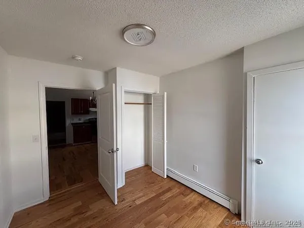 an empty room with wooden floor