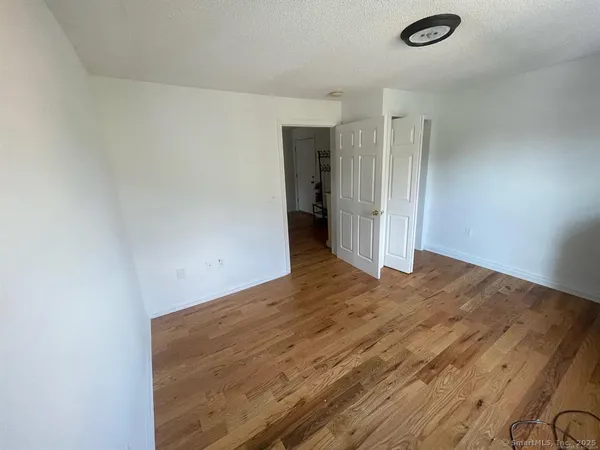 a view of a livingroom with wooden floor