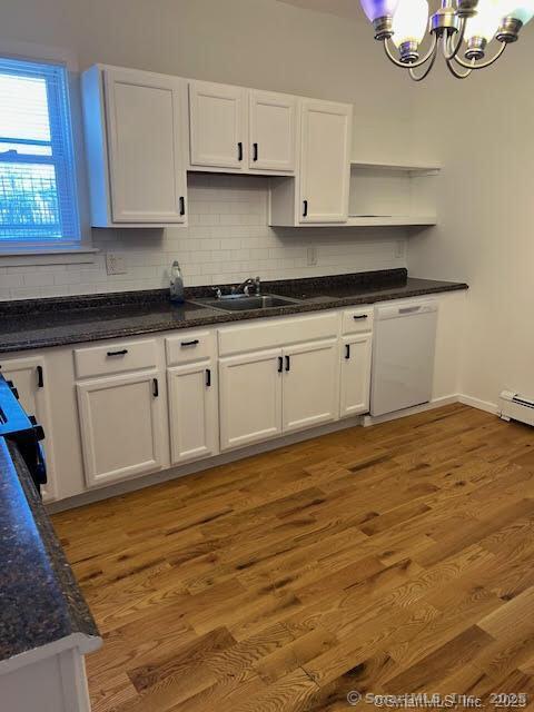243 North Elm Street Torrington, CT 06790 - Photo 10 of 23 a kitchen with granite countertop white cabinets and wooden floor
