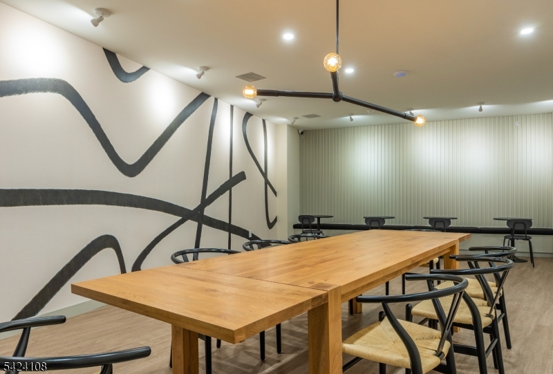 558 Market Street Newark, NJ 07105 - Photo 14 of 17 a room with table chairs and wooden floor