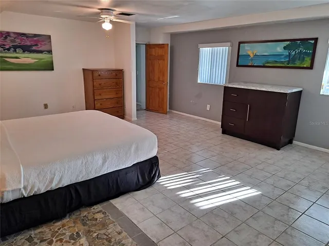 a bedroom with a bed and a dresser