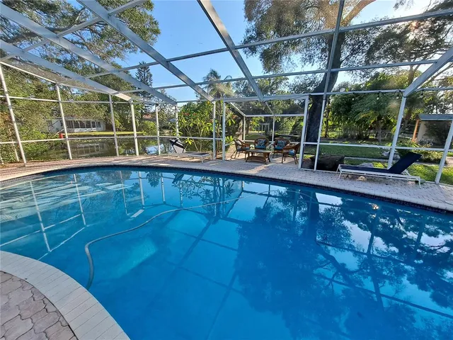 a view of a swimming pool with a patio
