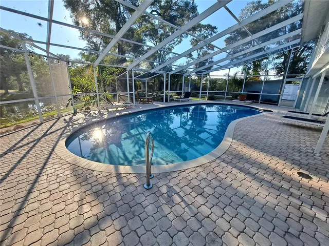 a view of a swimming pool with a patio