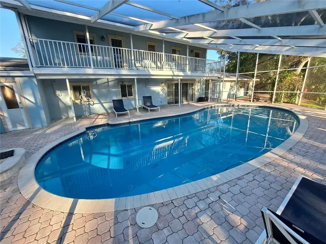 a view of swimming pool with outdoor seating