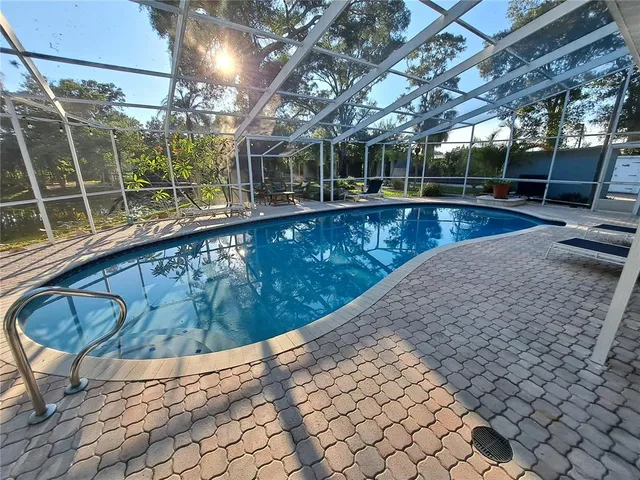 a view of a swimming pool with a patio
