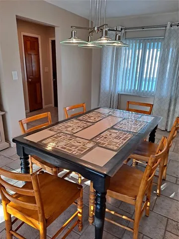 a bed sitting in a room next to a window