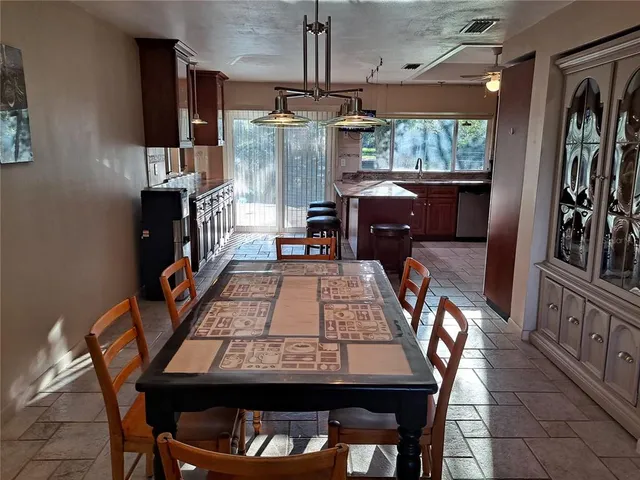 a dining room with furniture and window