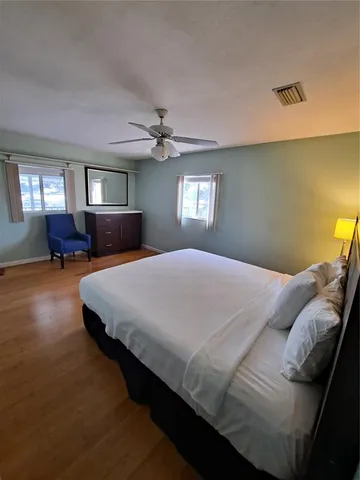 a bedroom with bed and window