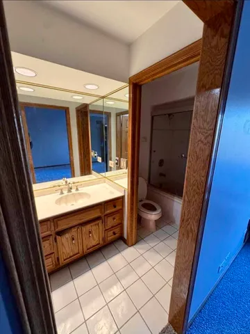 a view of staircase with white walls