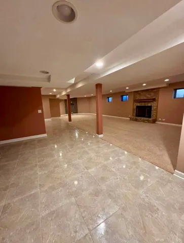 a view of an empty room with closet and storage