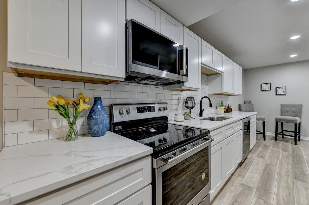 2503 Terrace Trail Decatur, GA 30035 - Photo 15 of 45 a kitchen with a stove a sink and a microwave