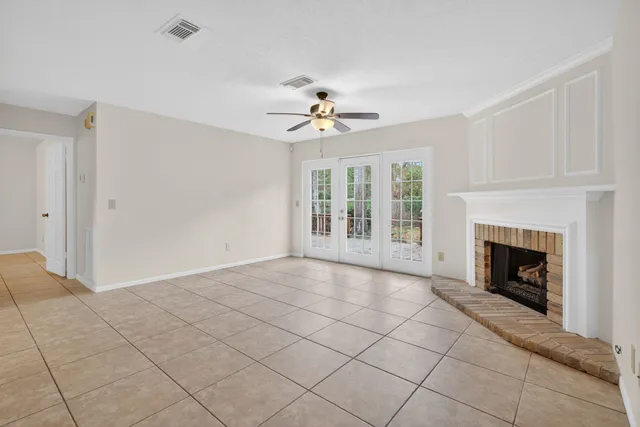 a view of an empty room with a fireplace