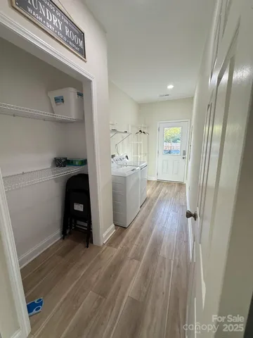 a view of a kitchen from the hallway