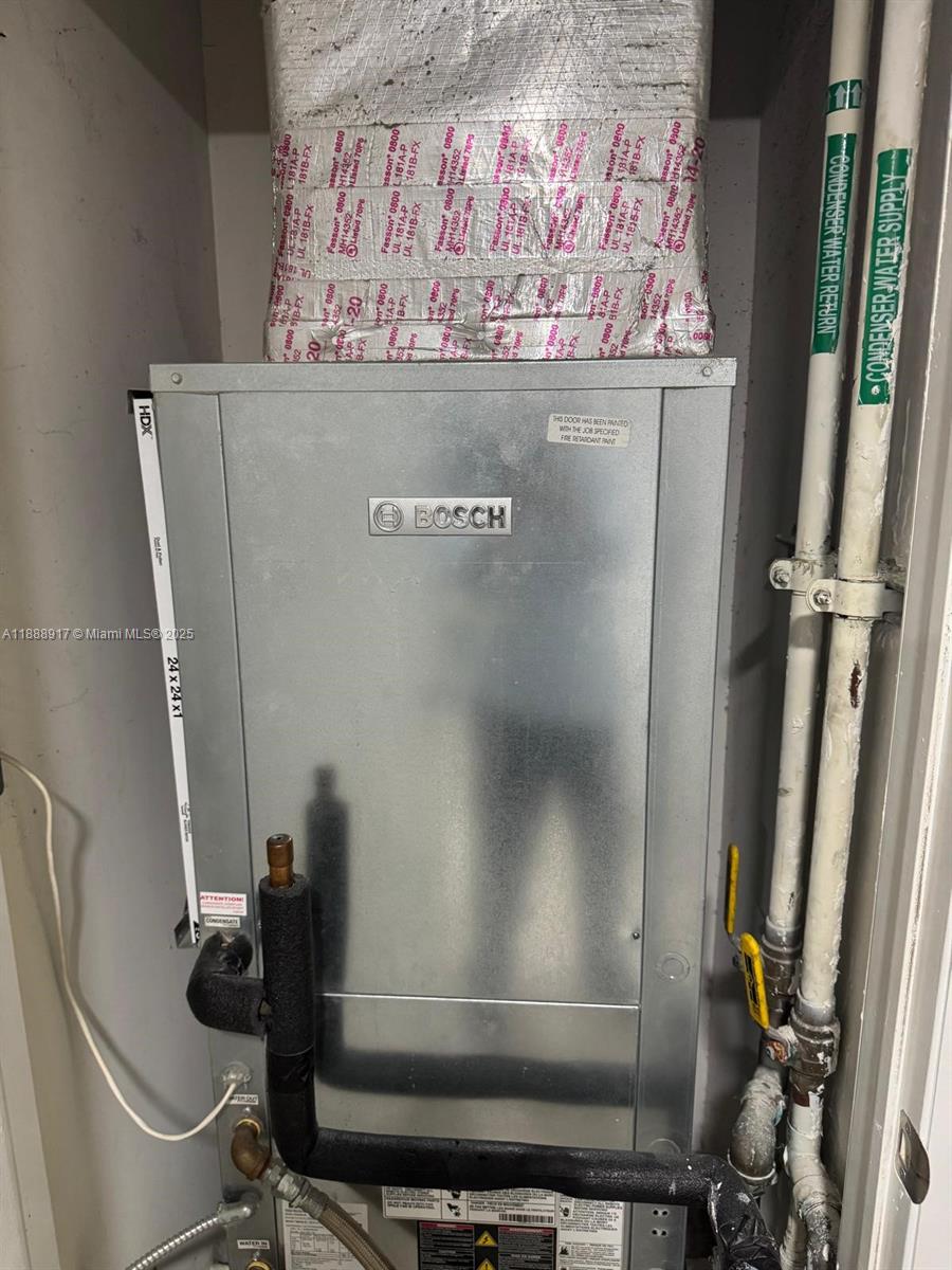 41 Southeast 5th Street, Unit 501 Miami, FL 33131 - Photo 30 of 36 a view of water heater room