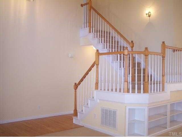5154 Fairmead Circle Raleigh, NC 27613 - Photo 3 of 11 a view of staircase with railing and white walls