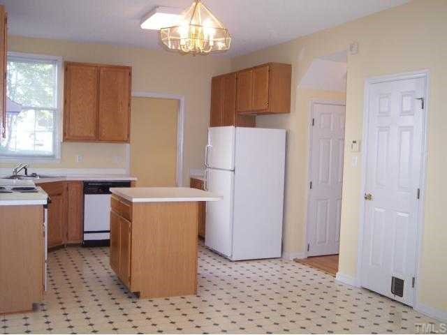 5154 Fairmead Circle Raleigh, NC 27613 - Photo 5 of 11 a utility room with cabinets washer and dryer