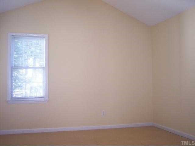 5154 Fairmead Circle Raleigh, NC 27613 - Photo 7 of 11 a view of a small space with window and wooden floor