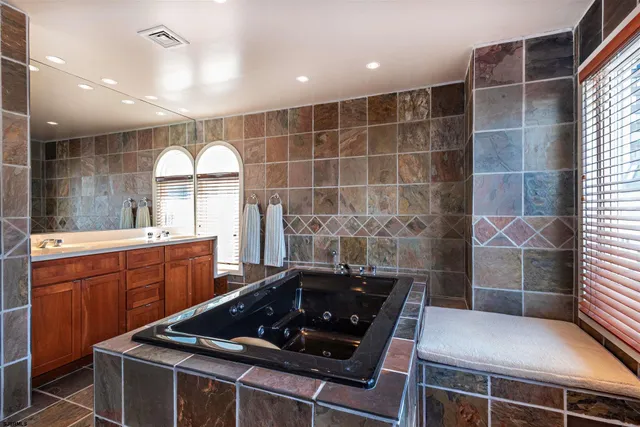 a kitchen with a sink a stove and cabinets