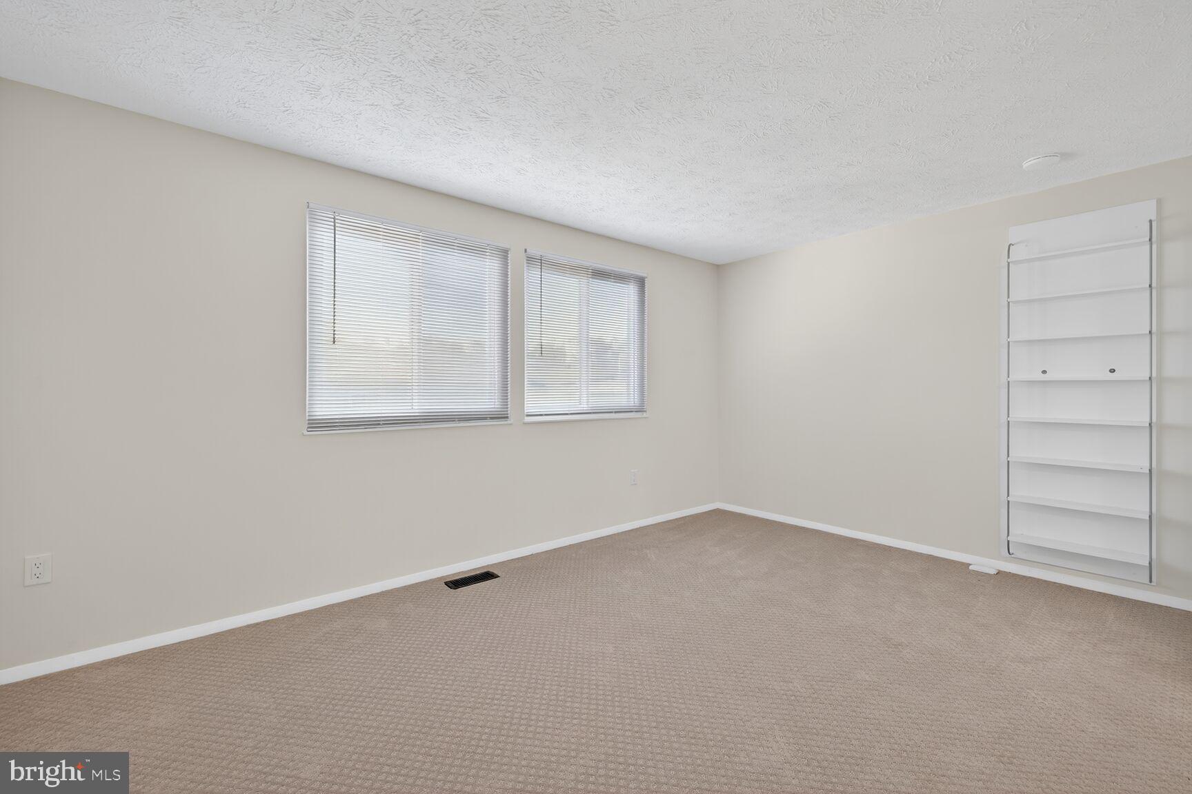 12515 Willow Spring Circle Germantown, MD 20874 - Photo 14 of 22 an empty room with closet