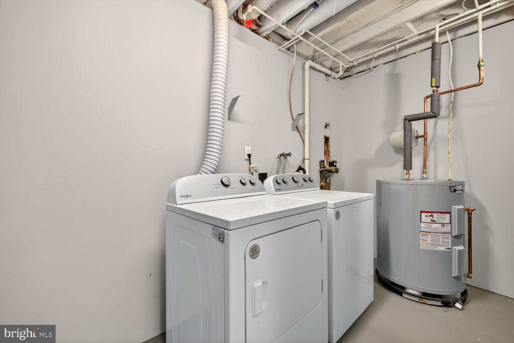 12515 Willow Spring Circle Germantown, MD 20874 - Photo 16 of 22 a utility room with dryer and washer