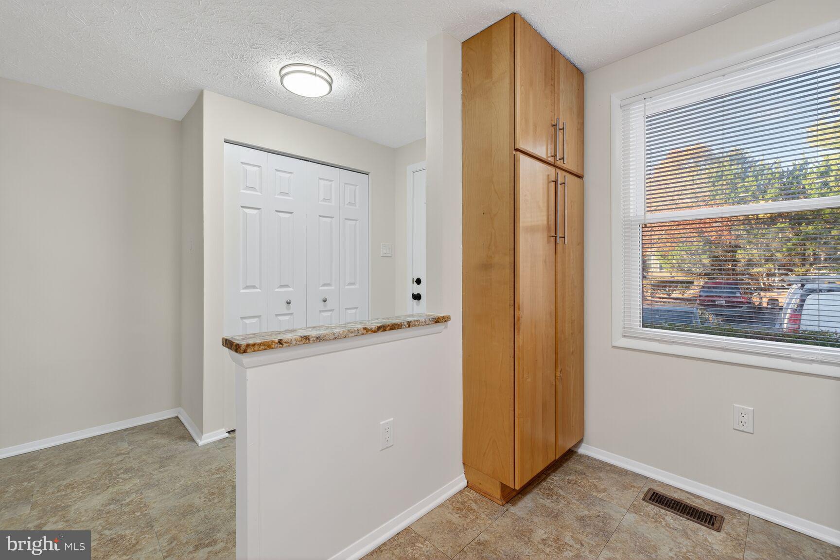 12515 Willow Spring Circle Germantown, MD 20874 - Photo 3 of 22 an empty room with mirror and windows