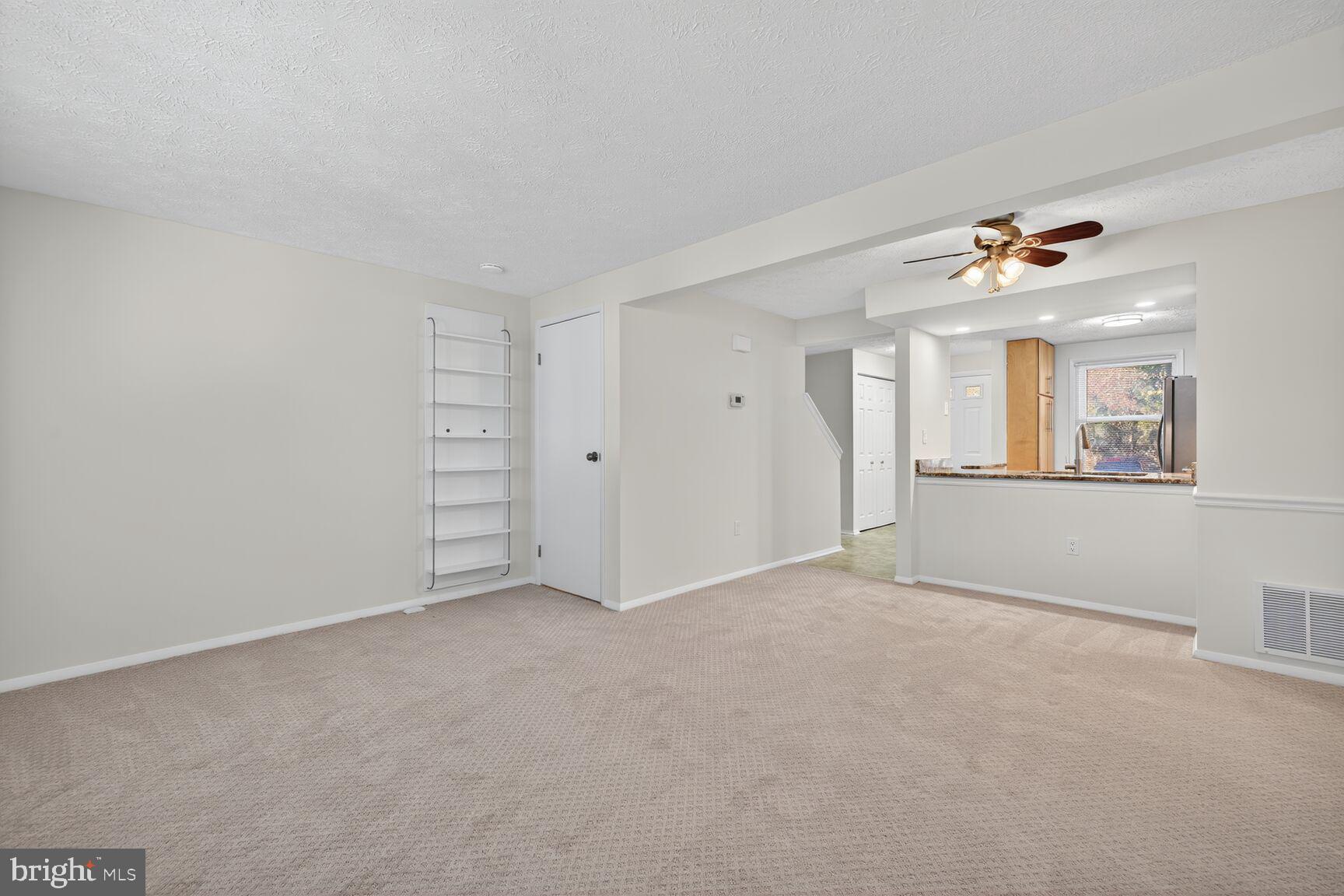 12515 Willow Spring Circle Germantown, MD 20874 - Photo 5 of 22 a view of an empty room with a window