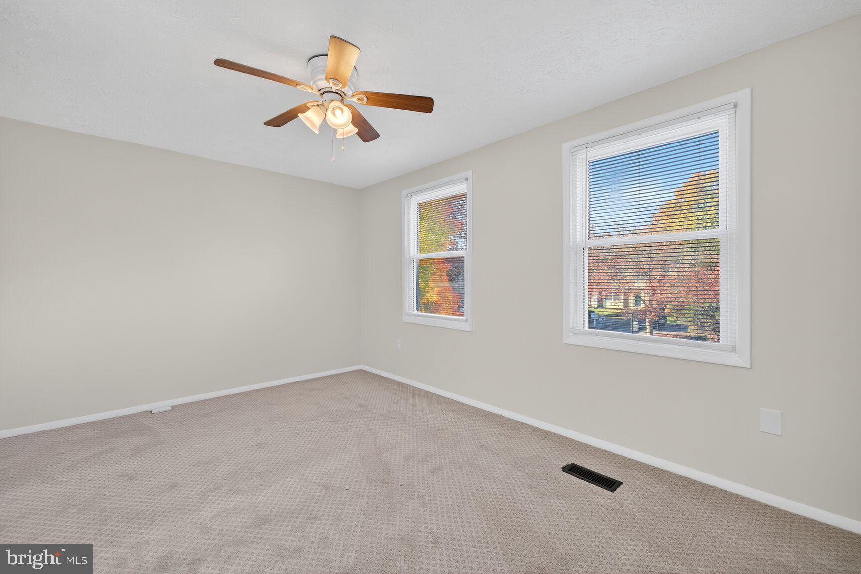 12515 Willow Spring Circle Germantown, MD 20874 - Photo 6 of 22 a view of an empty room with a window