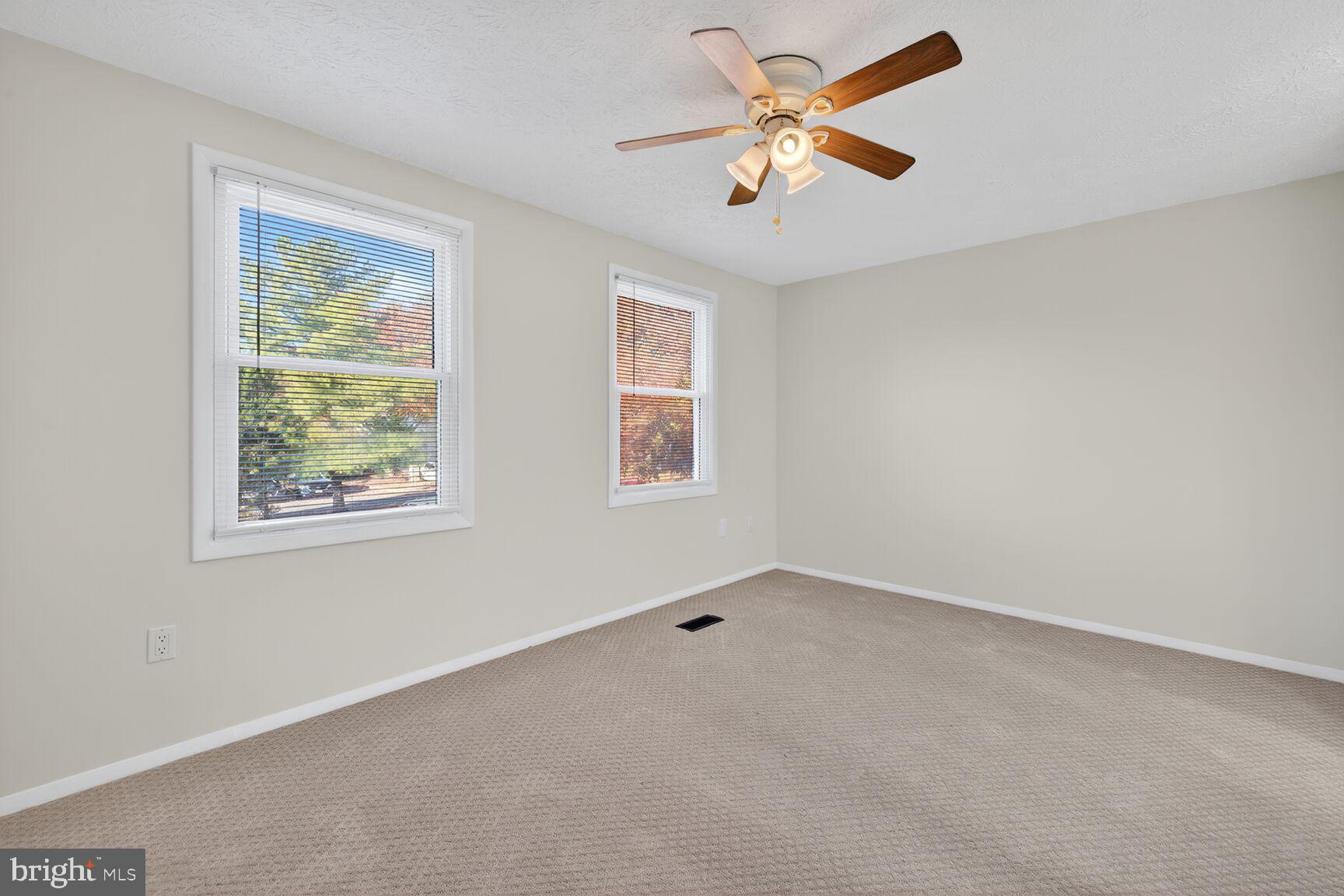 12515 Willow Spring Circle Germantown, MD 20874 - Photo 7 of 22 a view of an empty room with a window