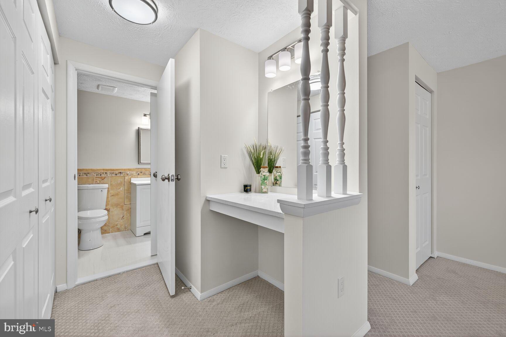 12515 Willow Spring Circle Germantown, MD 20874 - Photo 9 of 22 a view of bathroom with a sink and mirror