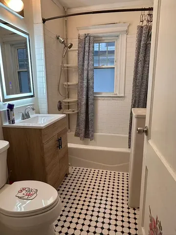 a bathroom with a tub and shower