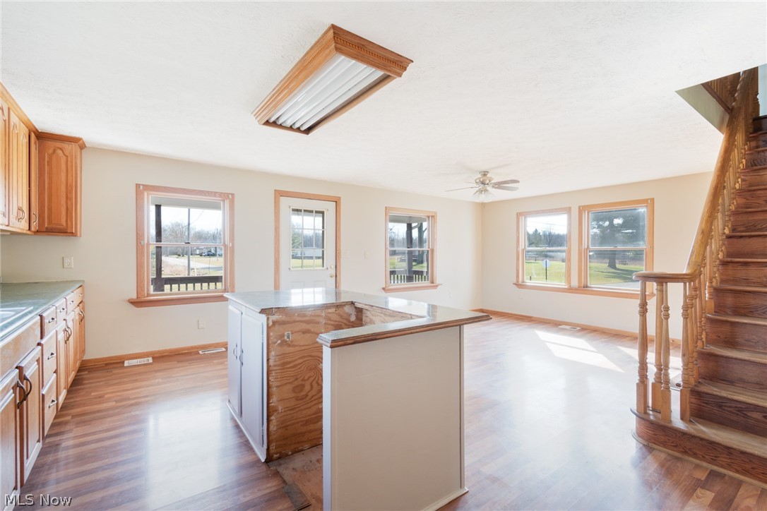 16333 Courtney Road Alliance, OH 44601 - Photo 15 of 31 Kitchen with a kitchen island, light hardwood / wood-style floors, and ceiling fan