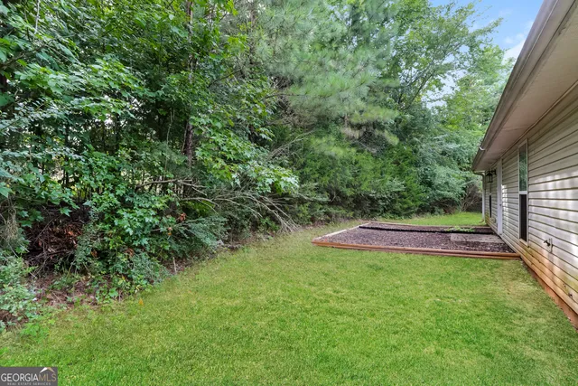 a view of a backyard with a garden