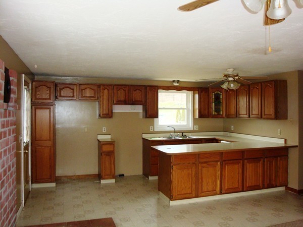 325 Torrey Road Southbridge, MA 01550 - Photo 2 of 25 a kitchen that has a sink a stove and cabinets