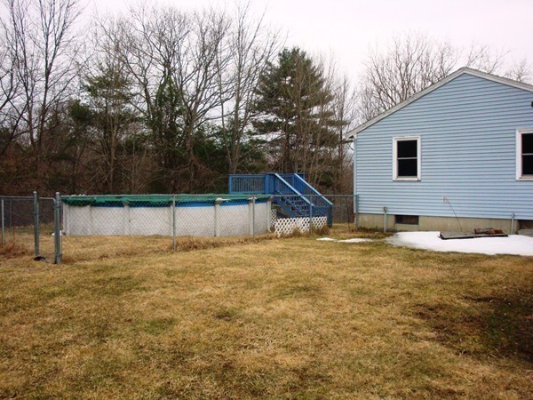 325 Torrey Road Southbridge, MA 01550 - Photo 24 of 25 a backyard of a house with wooden fence