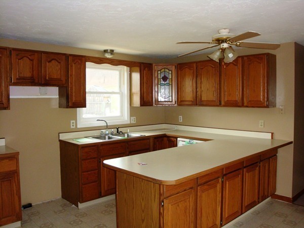 325 Torrey Road Southbridge, MA 01550 - Photo 8 of 25 a kitchen with a sink a stove and a refrigerator