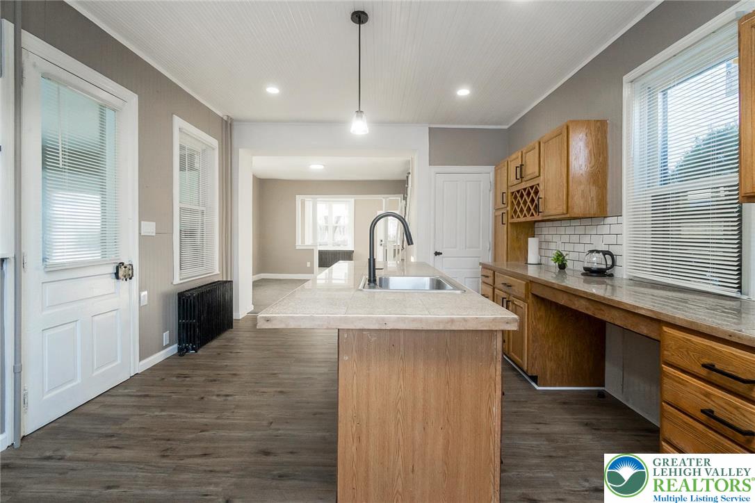 2213 Village Road Orefield, PA 18069 - Photo 26 of 41 a large kitchen with kitchen island a sink stainless steel appliances and cabinets