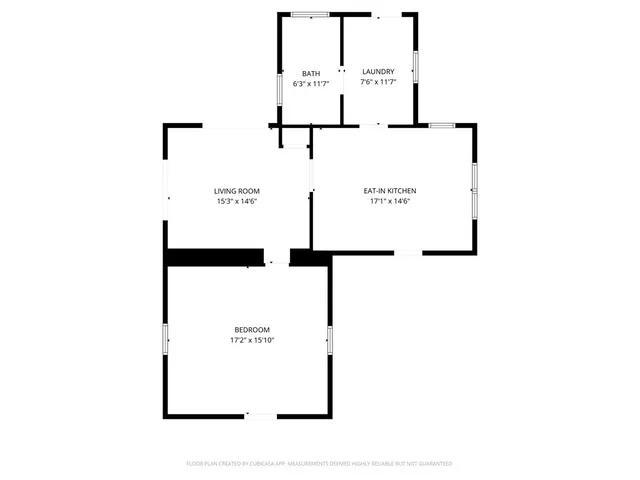 a bedroom with bed and a chandelier