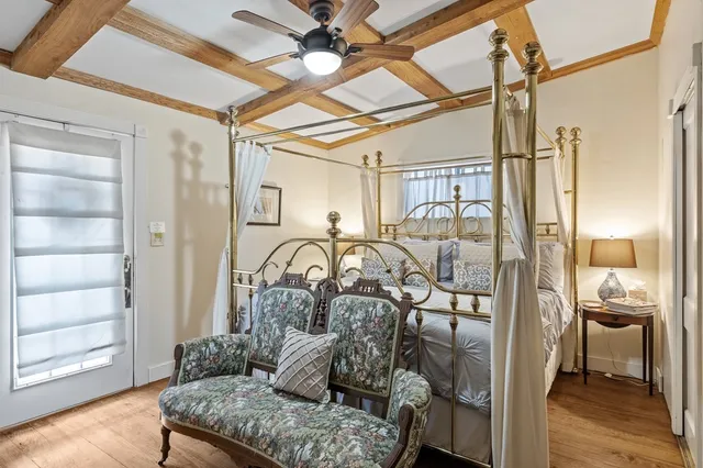 a bathroom with a toilet and a shower curtain