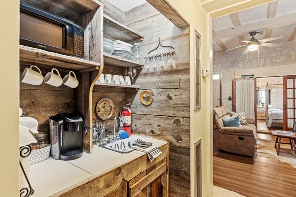 a front view of a house with outdoor seating and plants