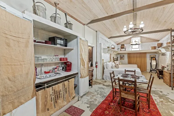 a bathroom with a sink toilet vanity and shower