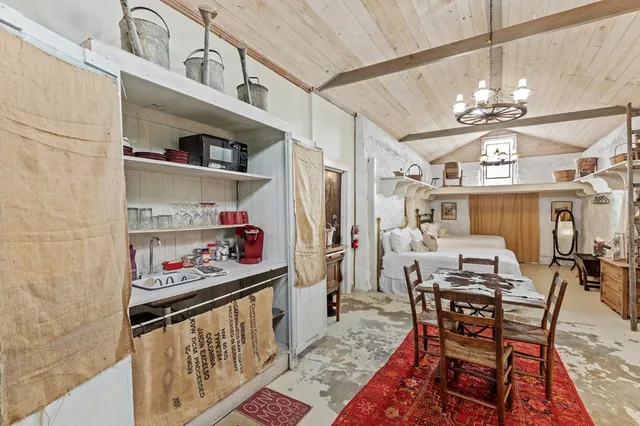 a bathroom with a sink toilet vanity and shower