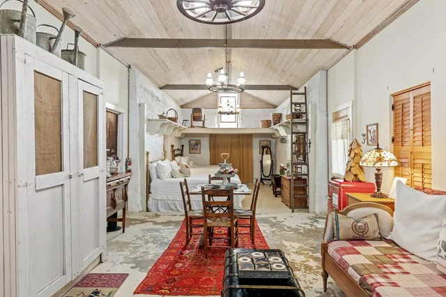 a view of a house with swimming pool and sitting area