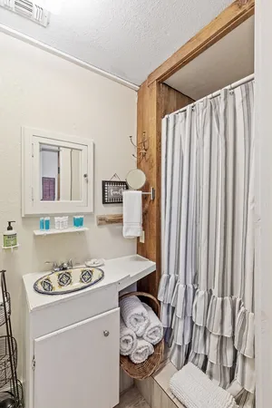 a view of road with large trees