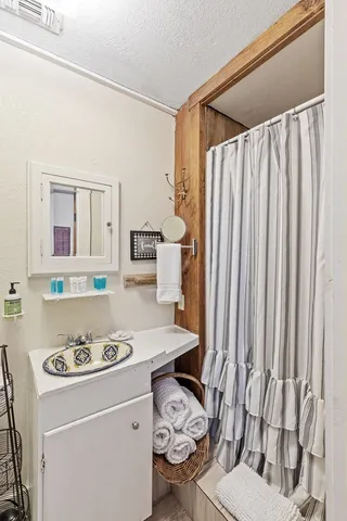 a view of road with large trees